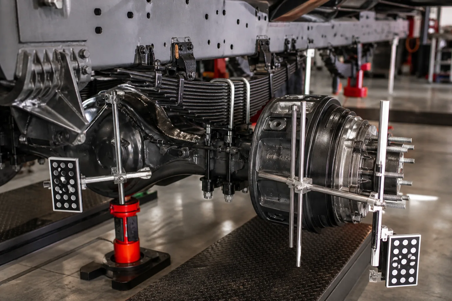 Truck axle alignment during mobile service